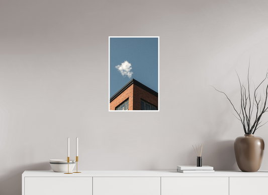 Cloud hovers above a building